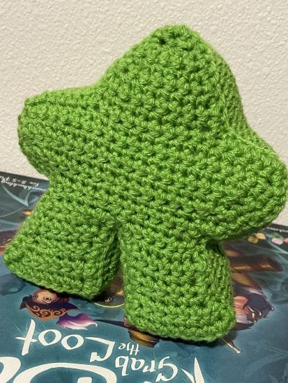 Picture of a green amigurumi meeple