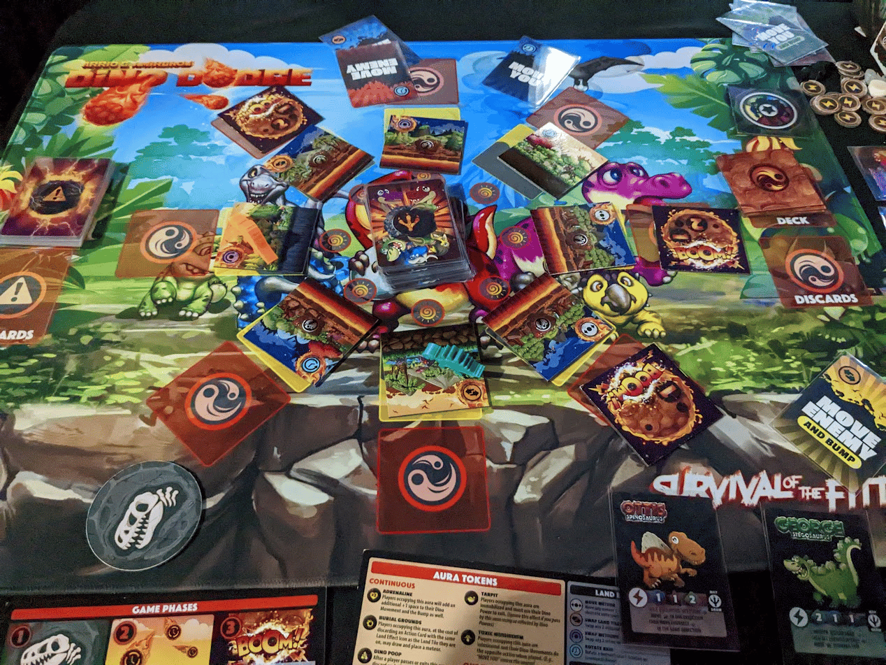 Photo of the dino dodge game board featuring cards and dinosaur tokens