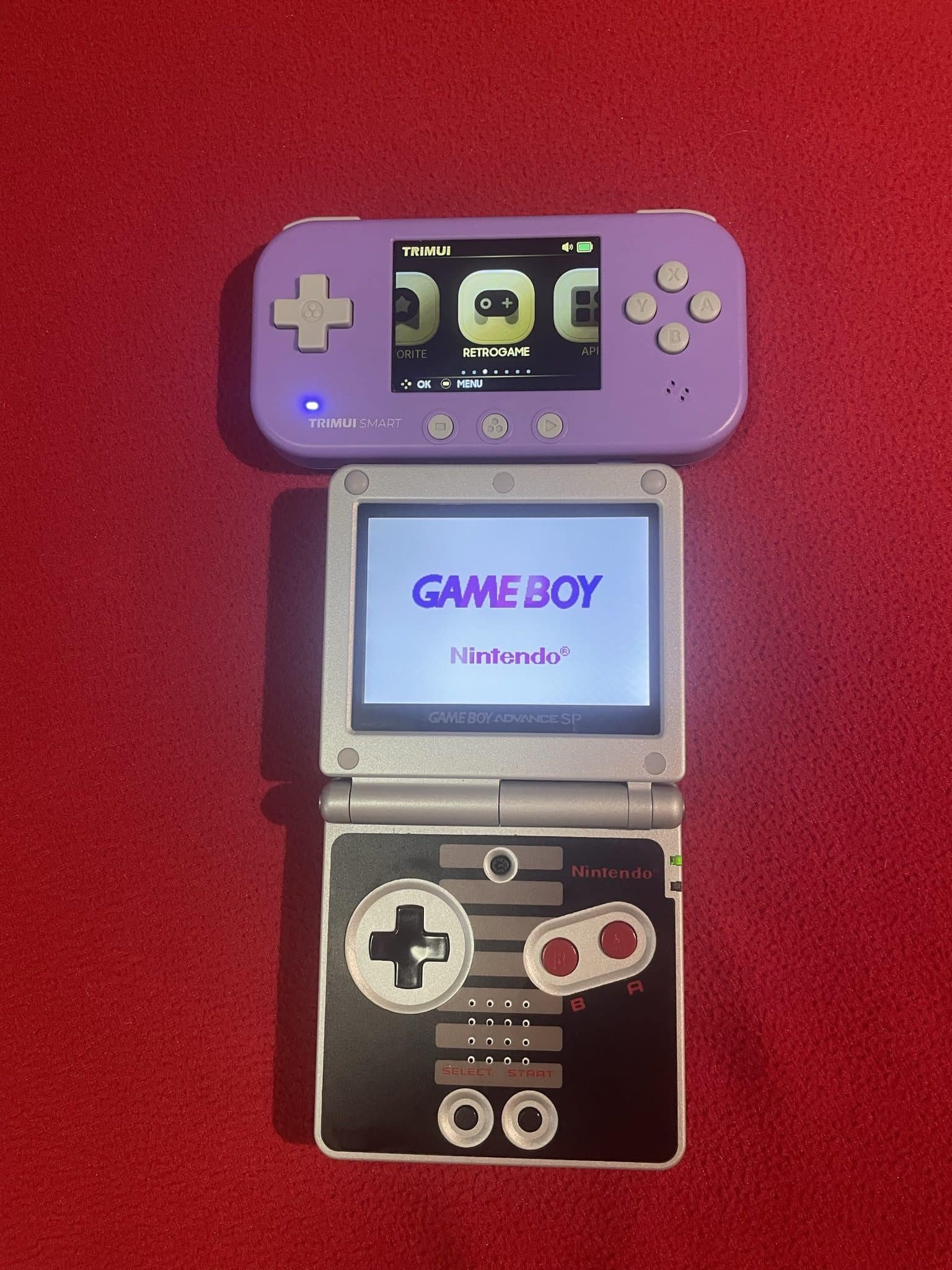 Trimui smart handheld emulation device compared to a gba sp. - the trimui smart is a comfortable, capable handheld held back by its tiny screen