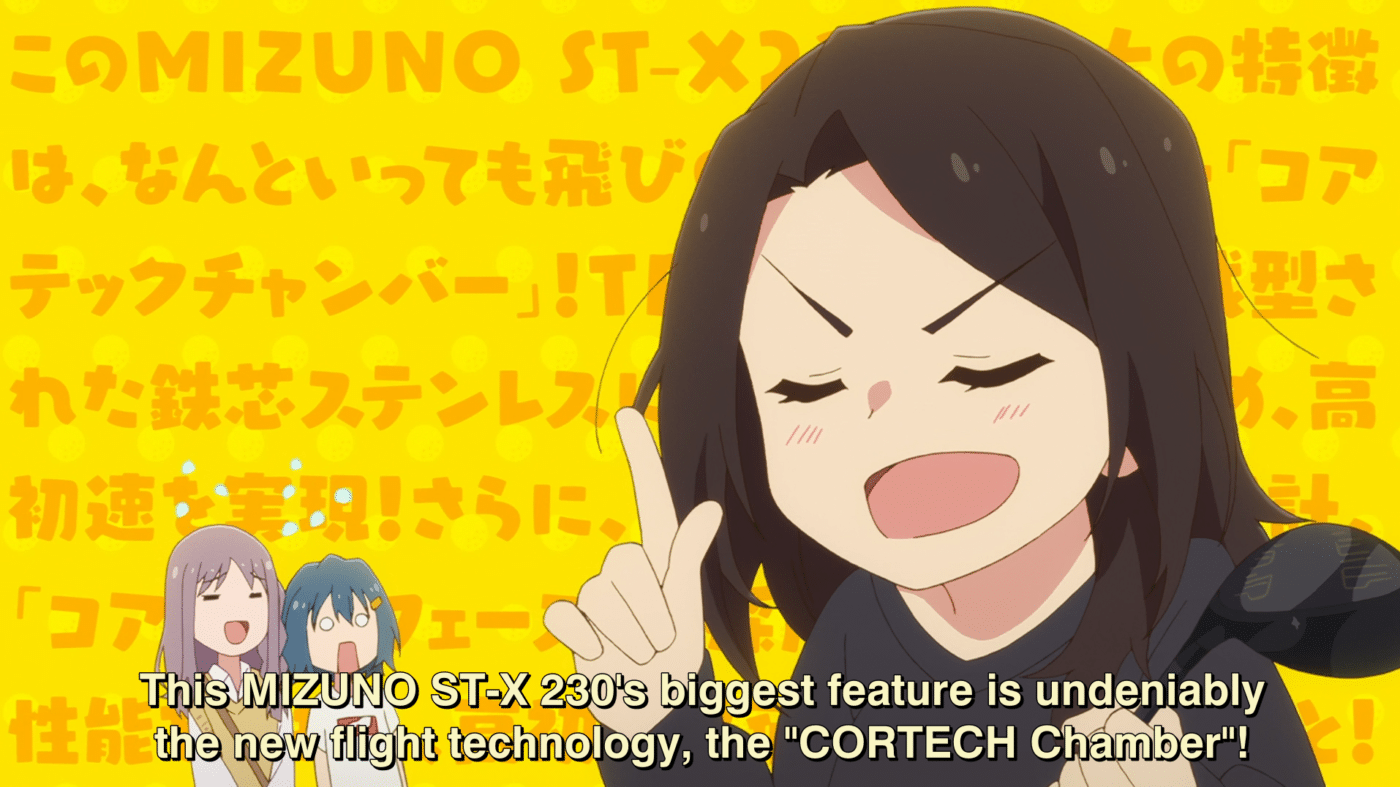 A screenshot from the anime sorairo utility. A young woman in the foreground is proudly explaining "this mizuno st-x 230's biggest feature is undeniably the new flight technology, the "CORTECH Chamber"!" in front of a wall of additional text to underscore the extent of her rambling. Her two companions are in the background, alternately astonished and tuned out of her monologue.