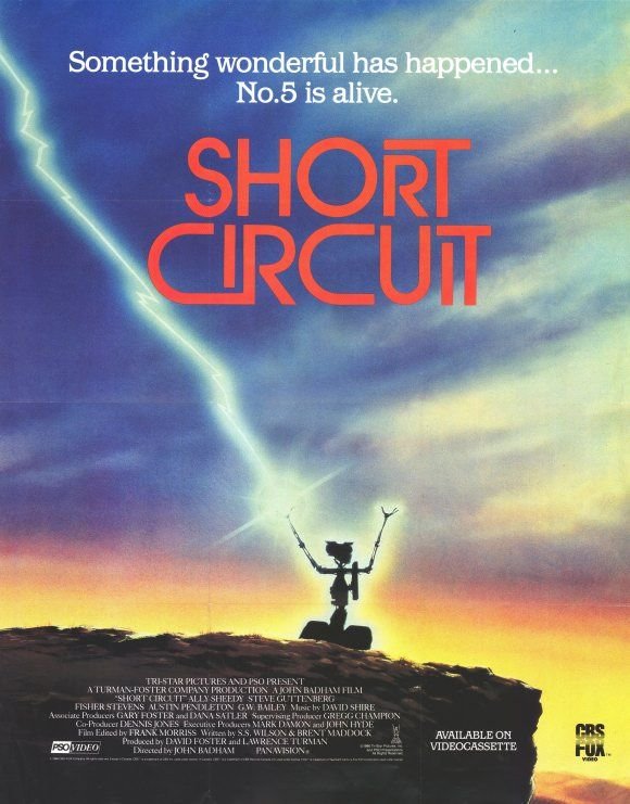 Movie poster for "short circuit" - tagline: "something wonderful has happened... No. 5 is alive. "